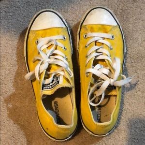 Yellow woman’s converse shoes